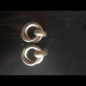 Bebe Gold round earrings.